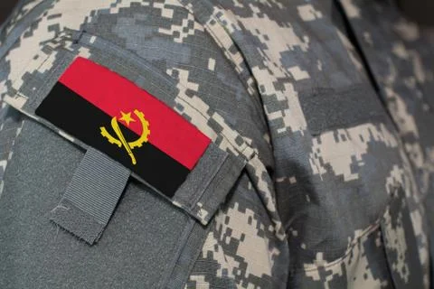 Angola army uniform patch flag on soldiers arm. Military Concept Stock Illustration