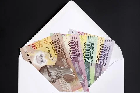 Angolan Kwanza in a white envelope Stock Photos