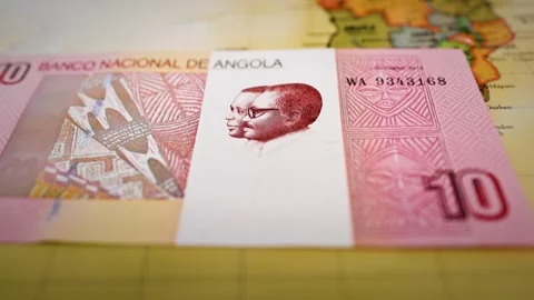 Angolan Ten Kwanza Banknote Featuring National Leaders and Abstract Art Stock Footage 340483353