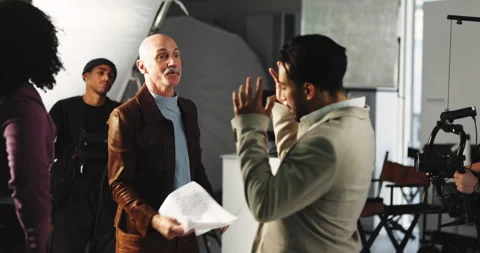 Angry actor, production team and people in studio for problem, poor script or Stock Footage 312250865