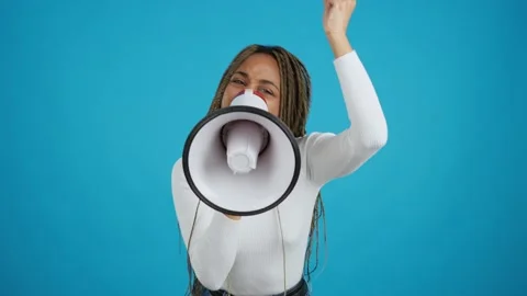 Angry african woman protesting while using a loudspeaker Stock Footage 231012330