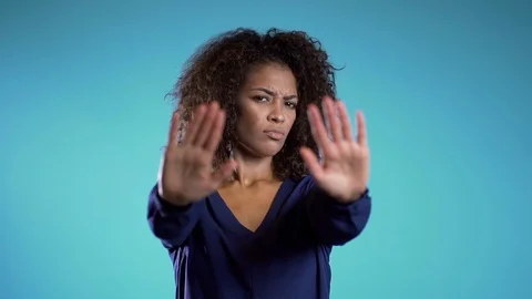Angry annoyed woman raising hands up to say no stop. Sceptical and distrustful Stock-Footage