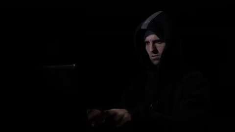 Angry anxious hacker computer programmer in hood attacking cyber security ser Stock Footage 86434623