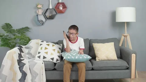 Angry asian boy arguing during a phone call Stock Footage 156080923
