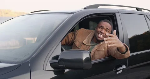 Angry black driver behind the wheel of a car Stock Footage 172281878