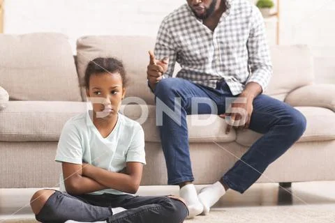 Angry Black Father Scolding Stubborn Little Daughter For Bad Behavior