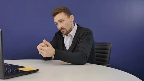 Angry boss has a business conversation on webcam in the office Stock Footage
