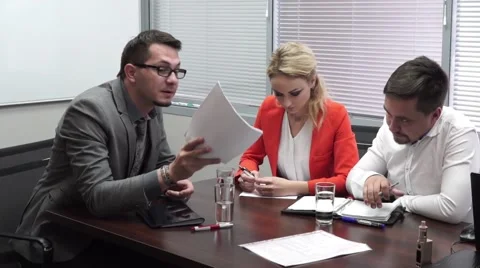 Angry boss shouting at staff, throwing paper. Business meeting Stock Footage 67752882