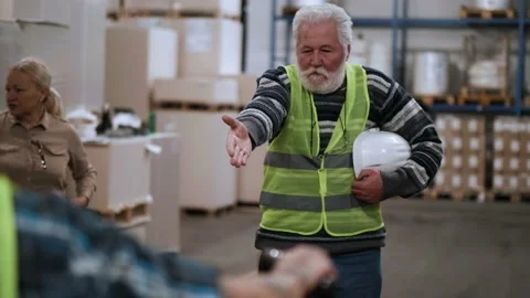 Angry boss shouting at workers, shows delivery delay  to the warehouse Stock Footage 166709296