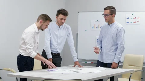 Angry Boss shouts at workers throwing documents in slow motion, failed project Stock Footage 137727914