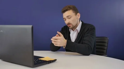 Angry boss threatens the partners with a wooden ax during video conference Stock Footage