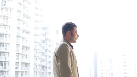 Angry boss turns and points an accusing finger right at the camera and returns  Stock Footage 100529975