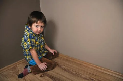 Angry boy in corner 스톡 사진