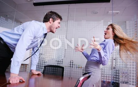 Angry busines sman screaming at employee Stock Photos
