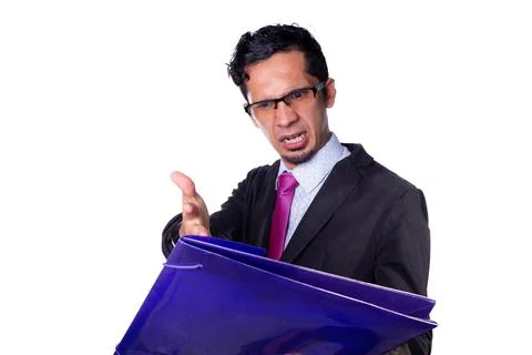 Angry businessman checking and complaining about some documents. Businessman Stock Photos