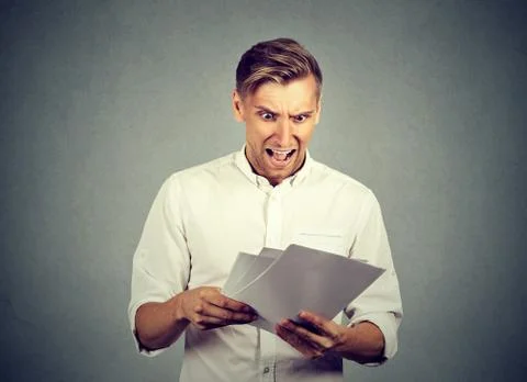 Angry businessman with documents Stock Photos