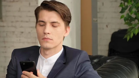 Angry businessman having problem with mobile. 스톡 동영상 129637645