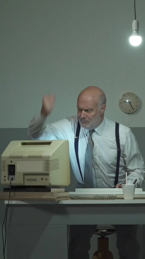 Angry businessman hitting his outdated computer Stock Footage 293680525