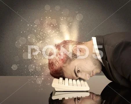 Angry businessman with lights and keyboard Stock Photos
