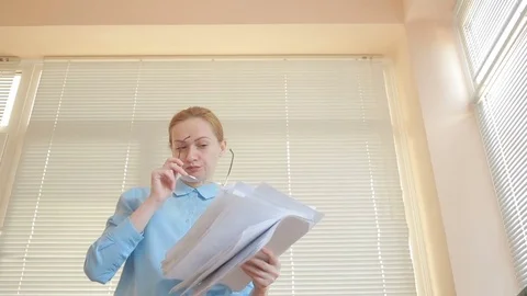 Angry businessman in office, piles up documents stack up Stock Footage