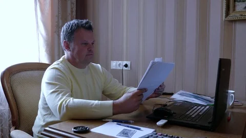Angry businessman scatters documents. Stock Footage 79352877