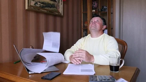 Angry businessman scatters documents. Stock Footage 79542725