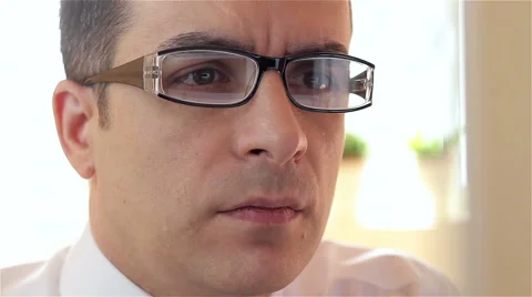 Angry businessman sitting in front of computer monitor Stock Footage 61342242