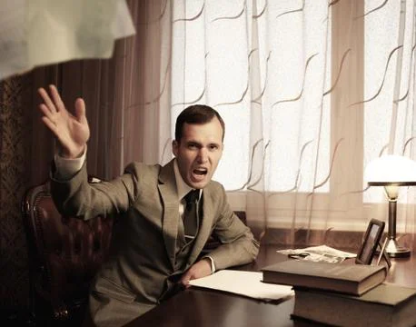 Angry businessman throwing a documents Stock Photos