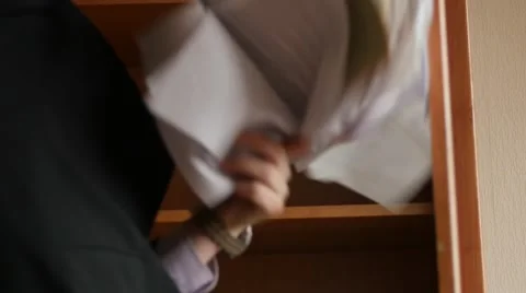 Angry businessman throws documents from cupboard slow motion Video stock 48804788