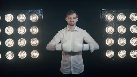 Angry Businessman Using Boxing Gloves Stock Footage 126663843