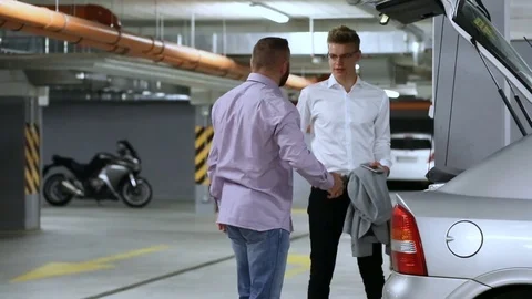 Angry businessmen having problem with a car and calling for a mechanic Stock Footage 80396053