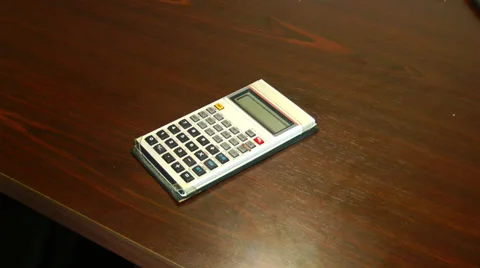 Angry with a calculator. Stockbeeldmateriaal 36255807