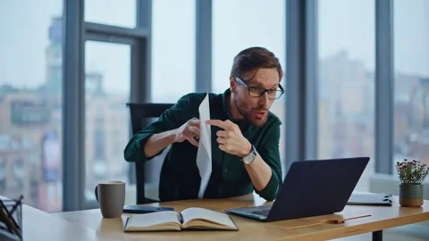 Angry ceo arguing video conference holding business documents at office closeup. Stock Footage 340297723