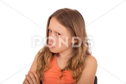 Angry child make a grimace Stock Photos