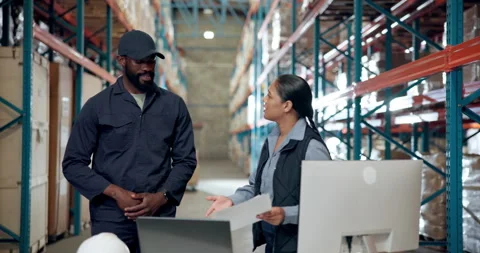 Angry, computer and documents with people in warehouse for disagreement or Stock Footage 335935690