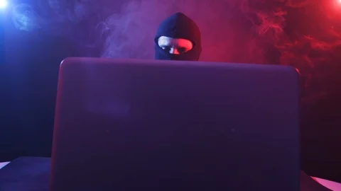 Angry computer hacker in suit stealing data from laptop Stock Footage 89183991