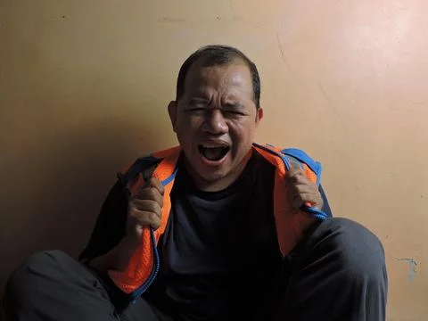 Angry Construction Worker Yelling in Frustration Indoors Stock Photos