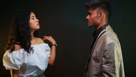 Angry Couple Exchanges Harsh Looks in Conflict Stock Footage 313669986