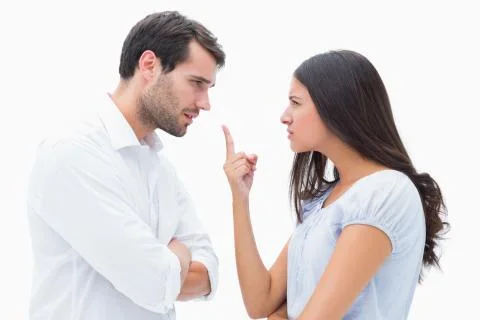 Angry couple facing off during argument Stock Photos