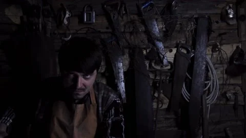 Angry crazy maniac with a rusty ax in an old house. copy space Video stock 137133960