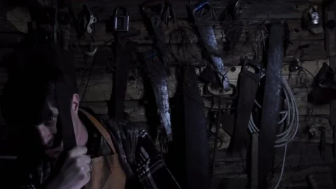 Angry crazy maniac with a rusty knife in an old house Video stock 135654934