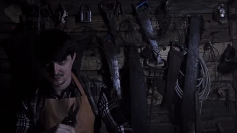 Angry crazy maniac with rusty sicator in an old house. copy space Video stock 140108662