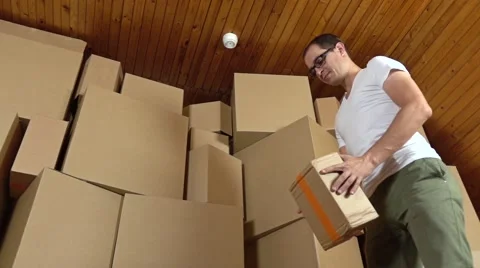 Angry customer throwing cardboard parcel on the floor. Super slow motion clip Stock Footage 67804209