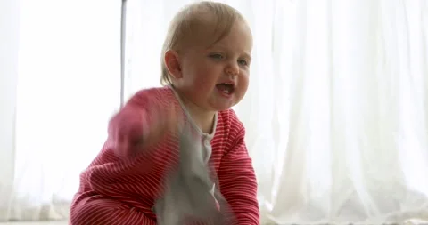 Angry cute baby crying and crawling away Stock Footage 318723645