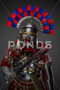 Angry dead roman soldier with helmet and sword Stock Image #166111236