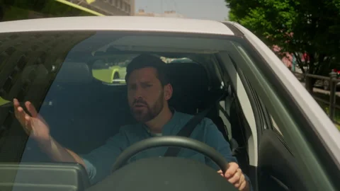 Angry dissatisfied man Caucasian guy businessman male driver shout roadway Stock Footage 310309230