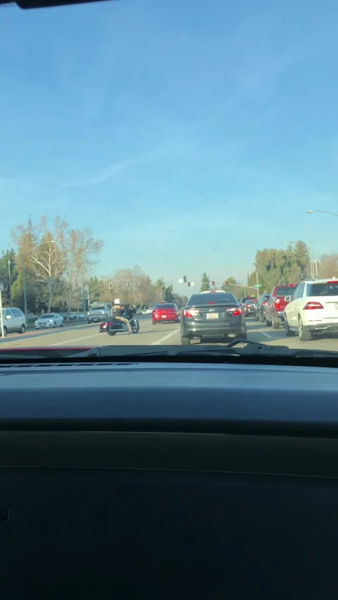 Angry Driver Clips Lane Splitting Motorcyclist, Fresno, California, USA - 05 Feb Stock Footage 205324711
