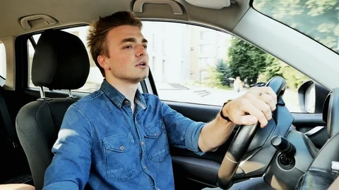 Angry driver drives a car. Man screams and gesticulates Stock Footage 118499522