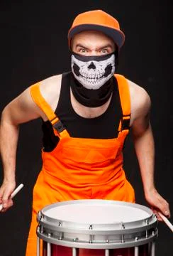 Angry drummer on a black background Foto stock
