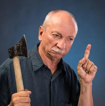 Angry elderly man with an ax 스톡 사진